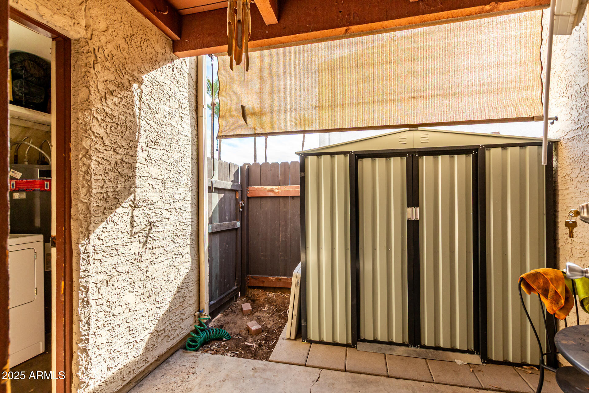 1927 East Hampton Avenue, Unit 129 Mesa, AZ 85204 - Photo 18 of 23 a view of a porch with furniture and front door