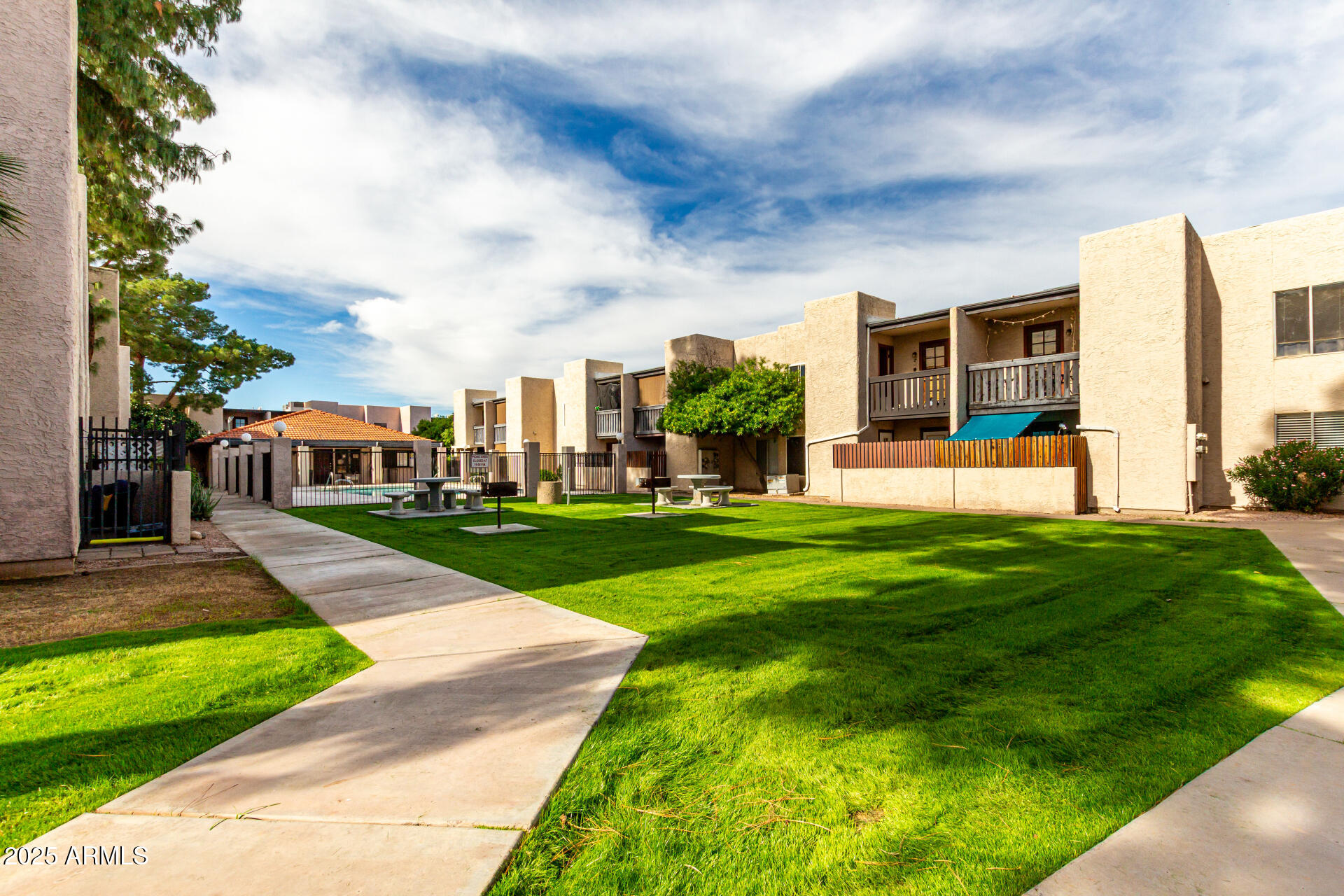 1927 East Hampton Avenue, Unit 129 Mesa, AZ 85204 - Photo 19 of 23 a front view of house with yard