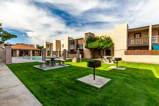 a view of a house with a swimming pool and a yard