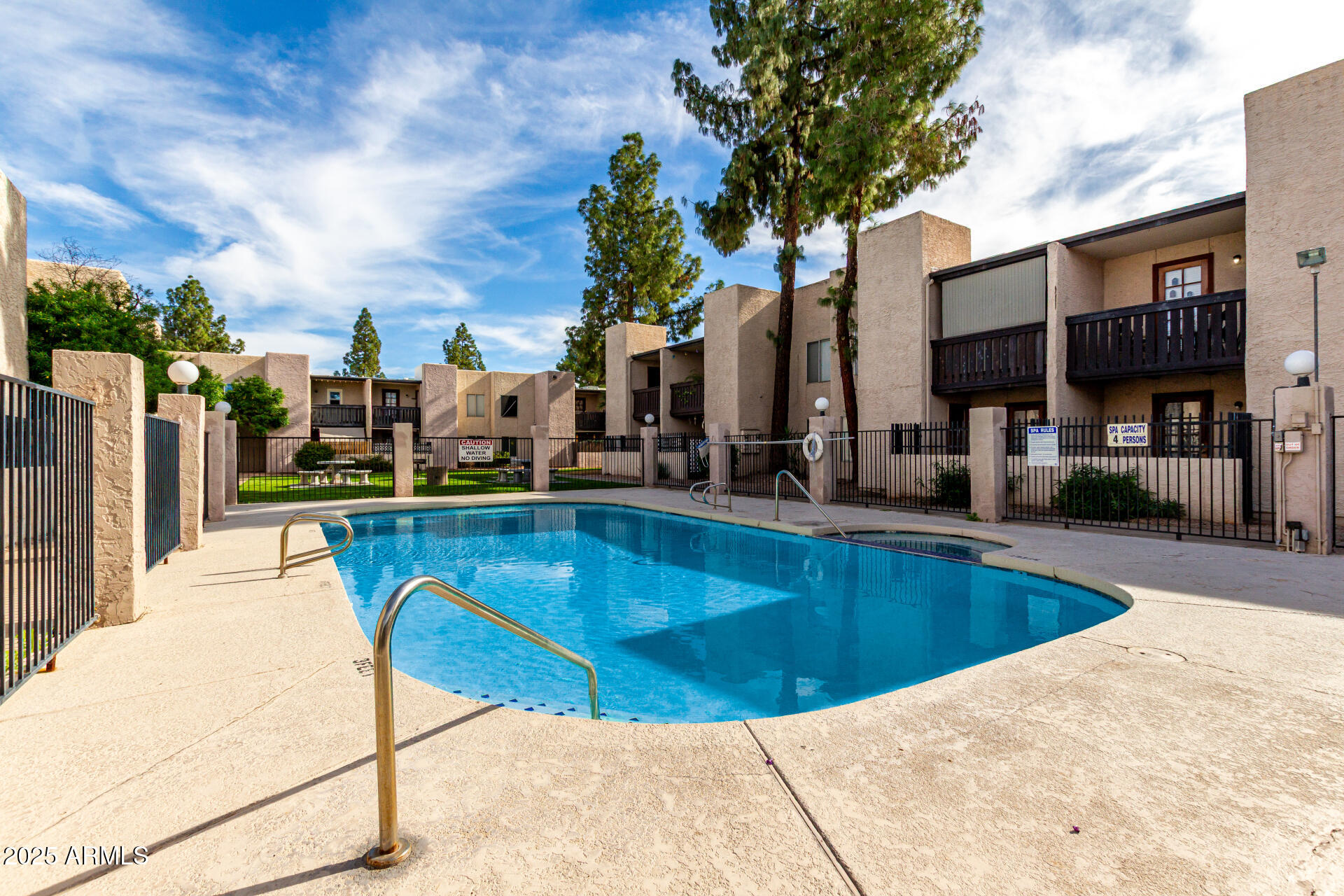 1927 East Hampton Avenue, Unit 129 Mesa, AZ 85204 - Photo 22 of 23 a view of a swimming pool with a lounge chairs