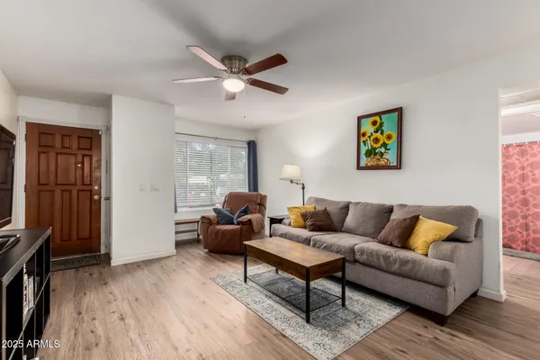 a living room with furniture and a flat screen tv