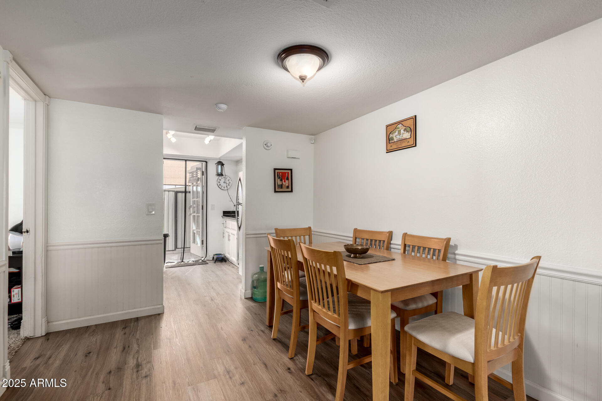1927 East Hampton Avenue, Unit 129 Mesa, AZ 85204 - Photo 5 of 23 a view of a dining room with furniture and wooden floor