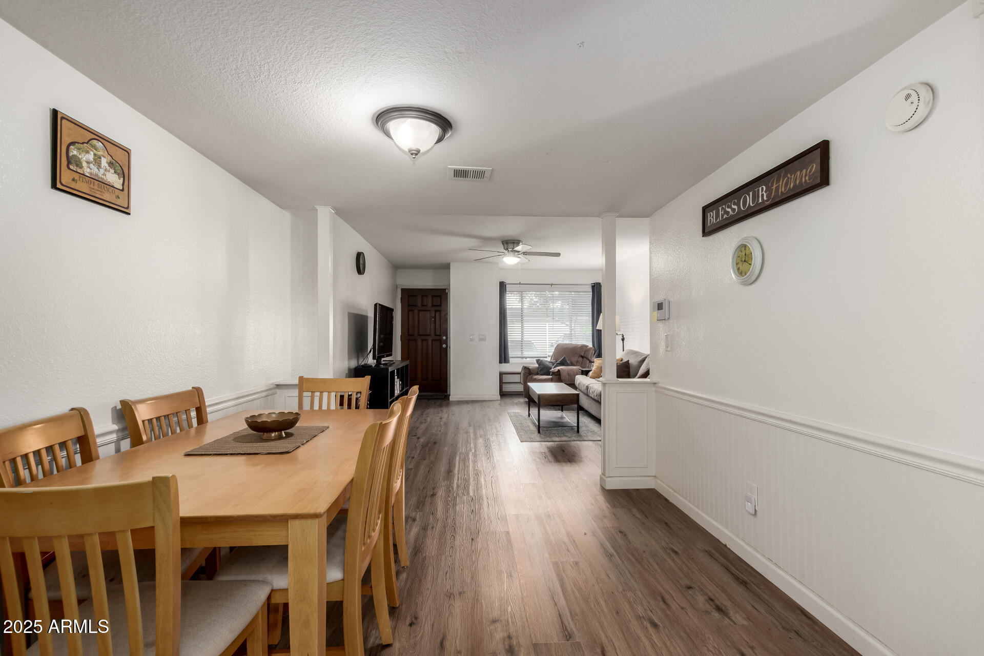 1927 East Hampton Avenue, Unit 129 Mesa, AZ 85204 - Photo 6 of 23 a view of a dining room with furniture and wooden floor