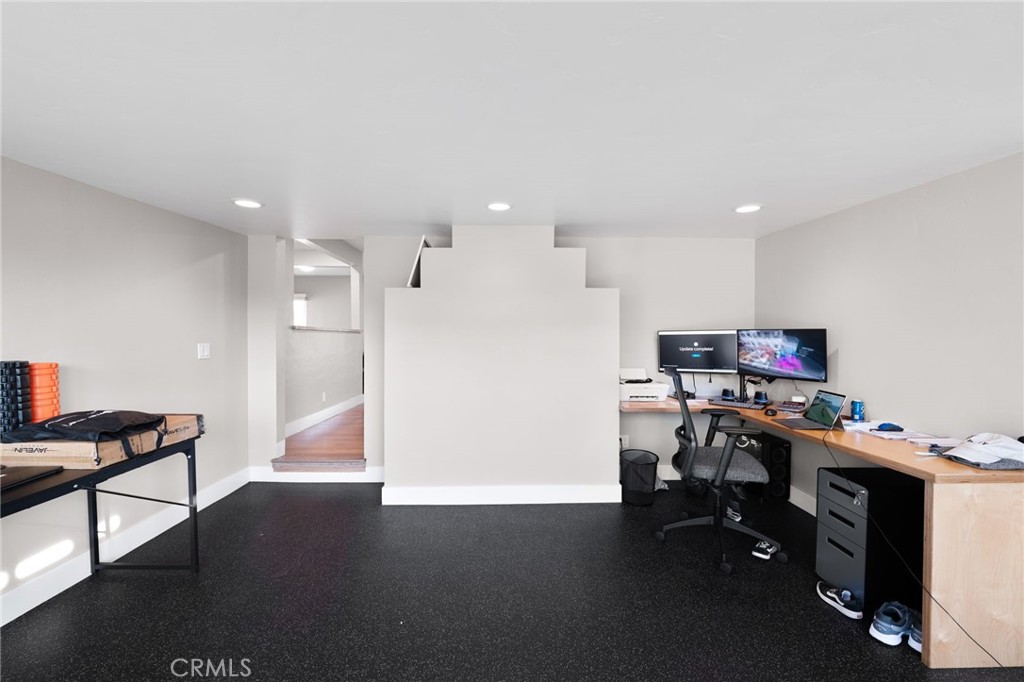 1612 Bellevue Road Redlands, CA 92373 - Photo 13 of 31 a view of a workspace with furniture and wooden floor