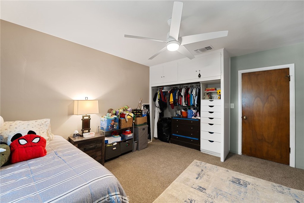 1612 Bellevue Road Redlands, CA 92373 - Photo 18 of 31 a bedroom with bed and a closet