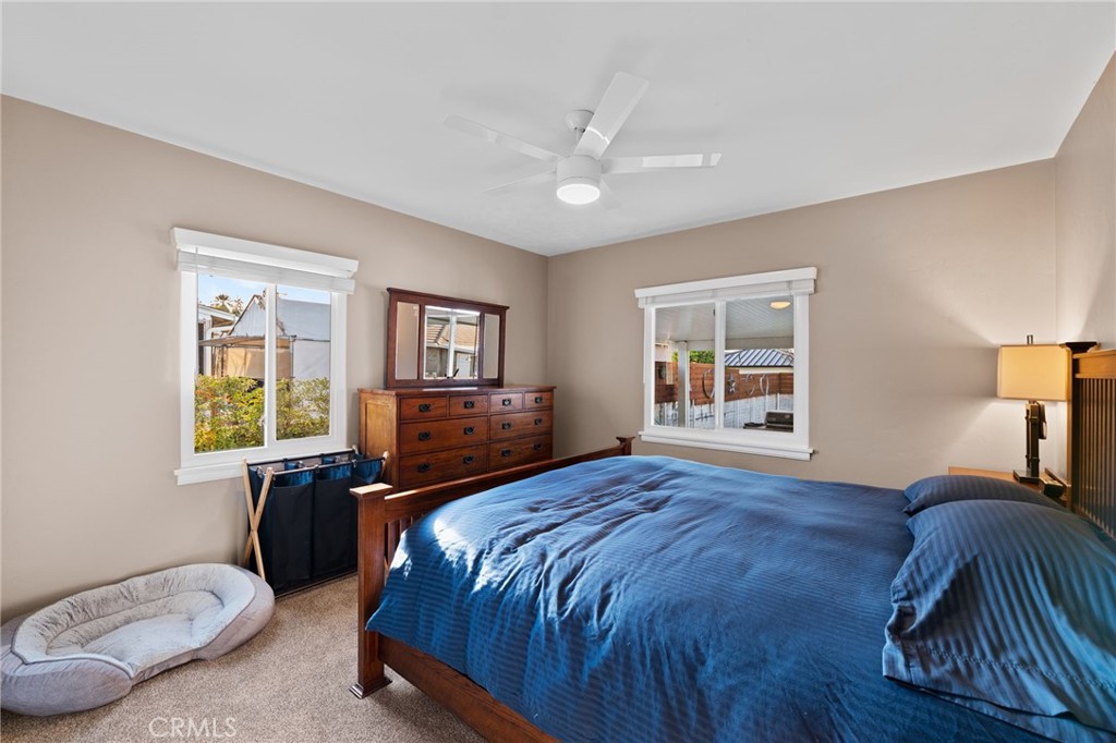 1612 Bellevue Road Redlands, CA 92373 - Photo 20 of 31 a spacious bedroom with a bed and wooden floor