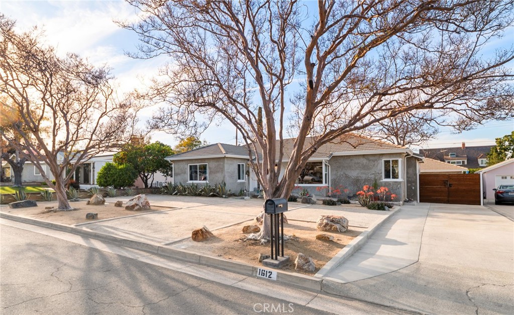 1612 Bellevue Road Redlands, CA 92373 - Photo 2 of 31 a view of a house with a yard covered in snow