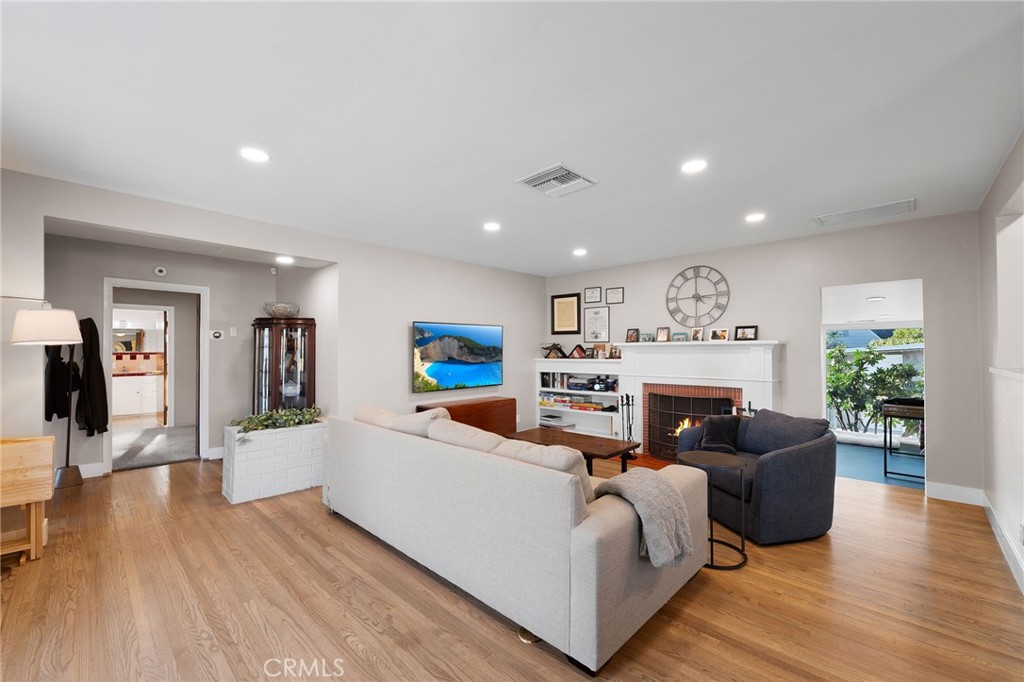 1612 Bellevue Road Redlands, CA 92373 - Photo 4 of 31 a living room with furniture and a wooden floor
