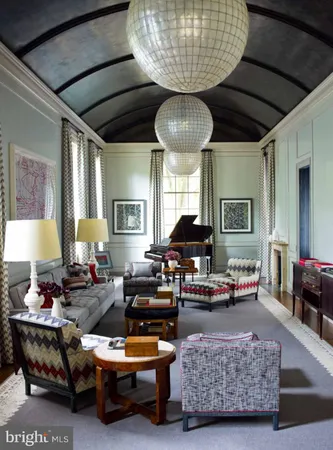 a living room with furniture and a lamp