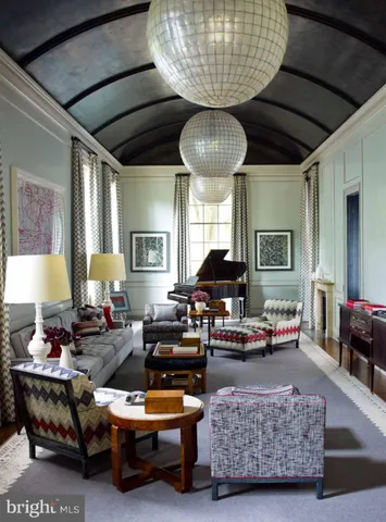 a living room with furniture and a lamp