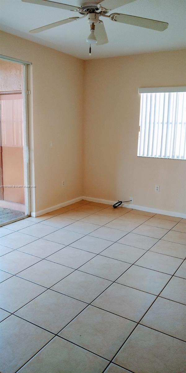 2748 Southwest 83rd Avenue, Unit 108 Miramar, FL 33025 - Photo 11 of 20 a view of a room with window and a ceiling fan