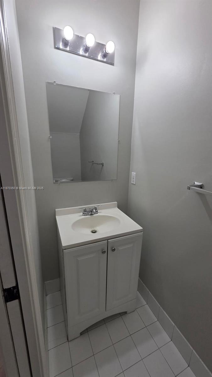 2748 Southwest 83rd Avenue, Unit 108 Miramar, FL 33025 - Photo 14 of 20 a utility room with a sink a vanity and a mirror