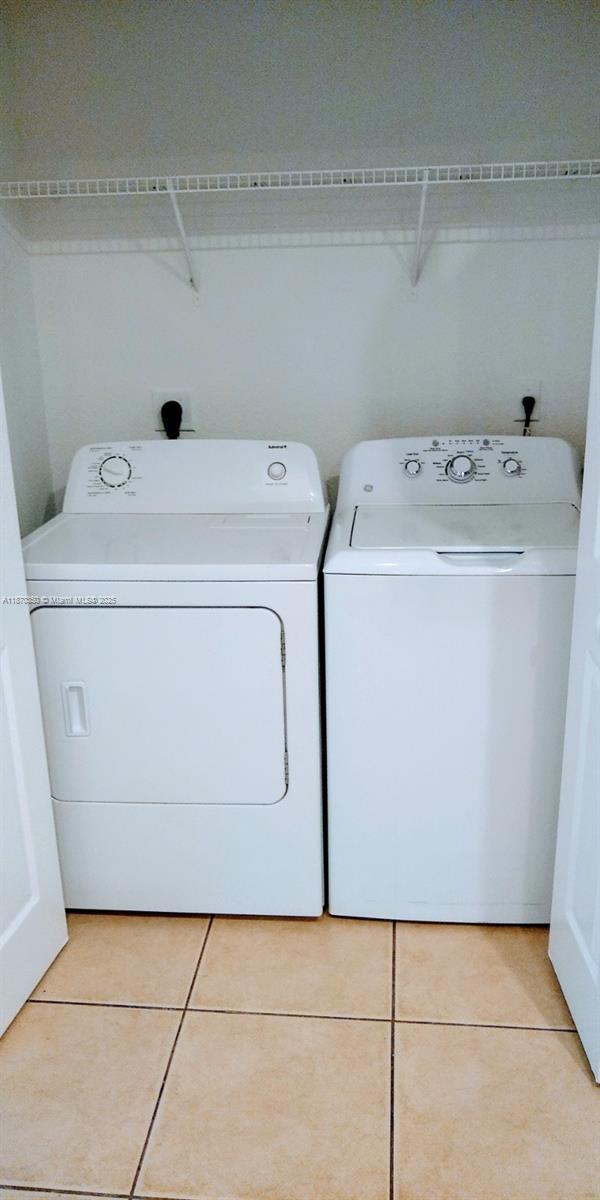 2748 Southwest 83rd Avenue, Unit 108 Miramar, FL 33025 - Photo 18 of 20 a utility room with dryer and washer