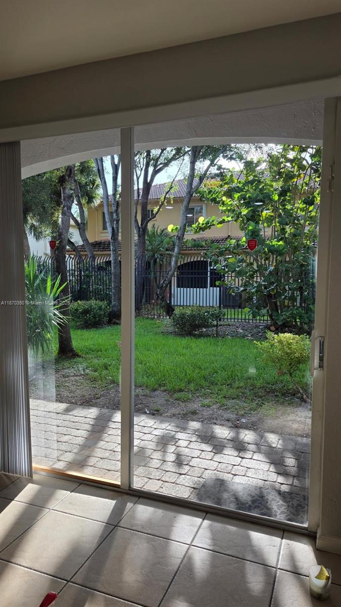 2748 Southwest 83rd Avenue, Unit 108 Miramar, FL 33025 - Photo 19 of 20 a view of a porch with a yard