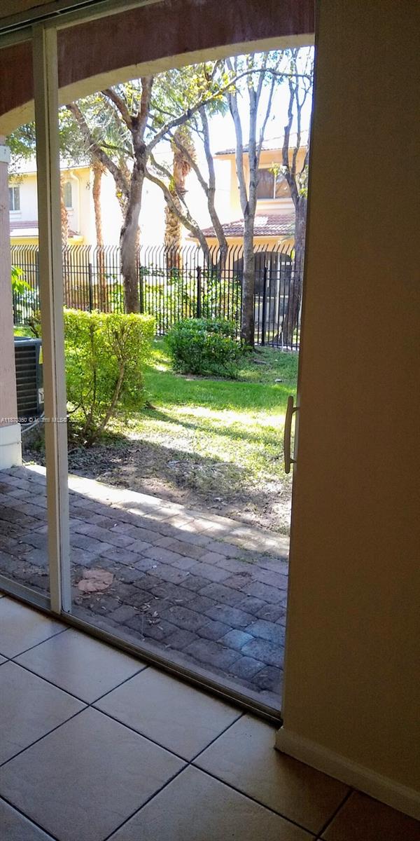 2748 Southwest 83rd Avenue, Unit 108 Miramar, FL 33025 - Photo 20 of 20 a view of porch with a yard