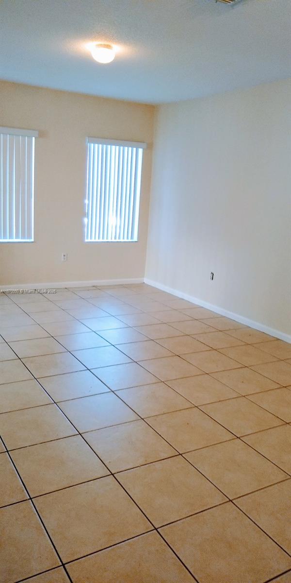 2748 Southwest 83rd Avenue, Unit 108 Miramar, FL 33025 - Photo 2 of 20 a view of an empty room and window