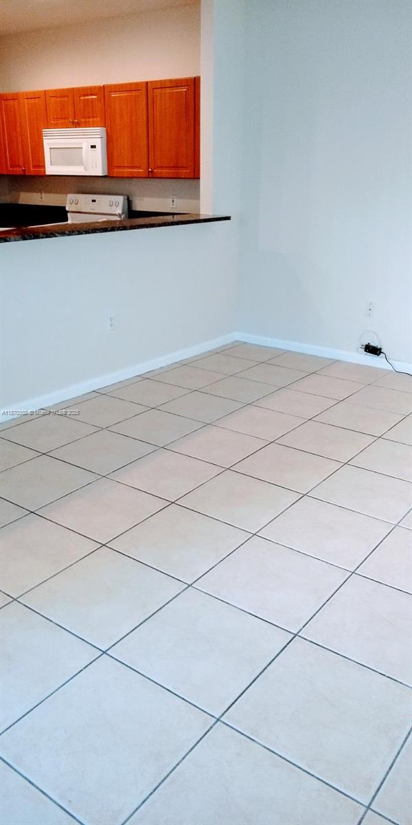 2748 Southwest 83rd Avenue, Unit 108 Miramar, FL 33025 - Photo 10 of 20 a kitchen with a sink and cabinets