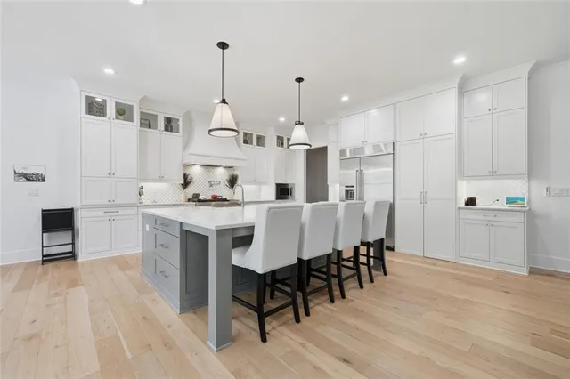 a bathroom with double vanity sink and a mirror