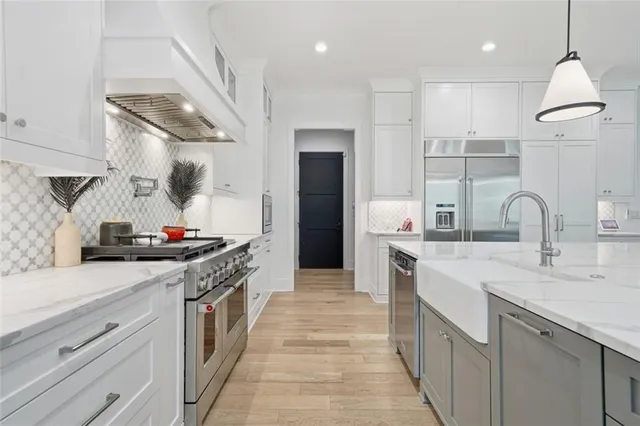 a spacious bathroom with a double vanity sink and a mirror