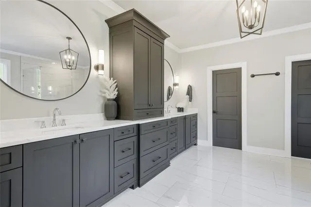 a bathroom with a granite countertop sink toilet and mirror