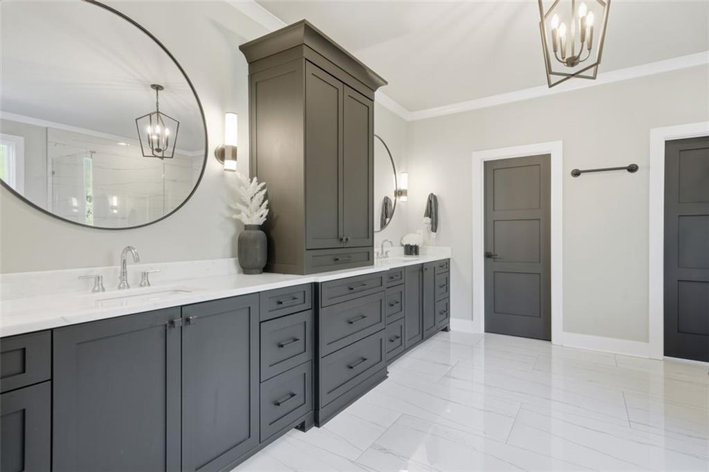 116 Owens Mill Place Canton, GA 30115 - Photo 16 of 65 a spacious bathroom with a double vanity sink and a mirror