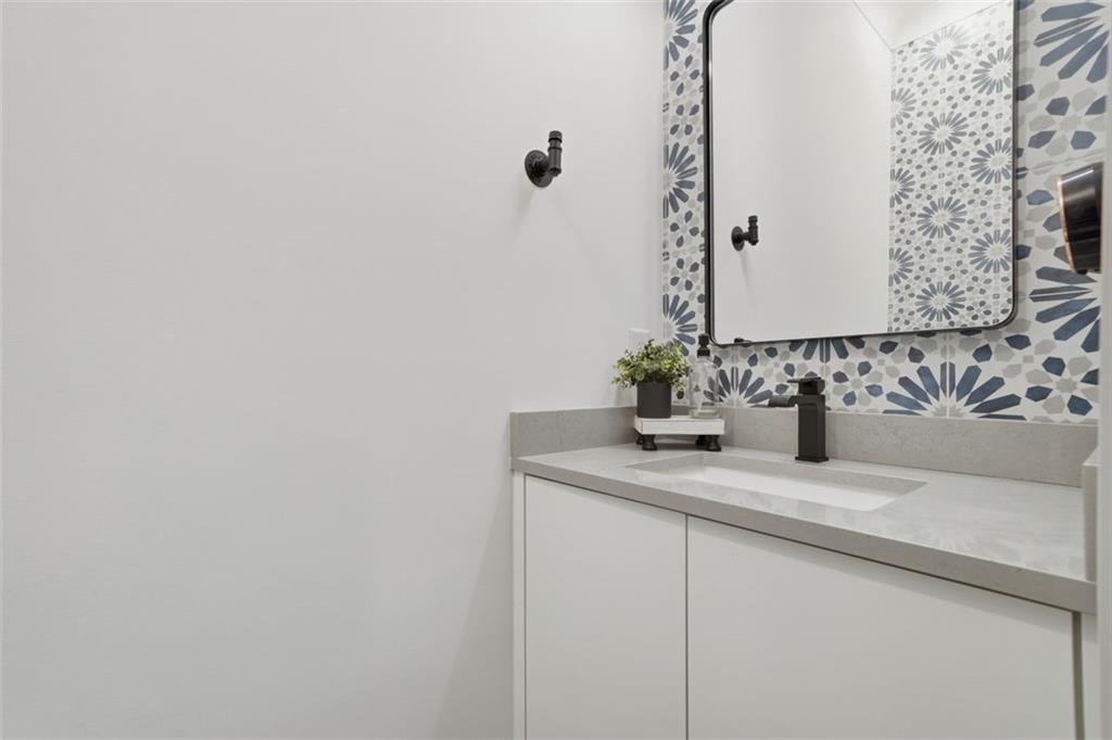 116 Owens Mill Place Canton, GA 30115 - Photo 17 of 65 a bathroom with a sink and a mirror