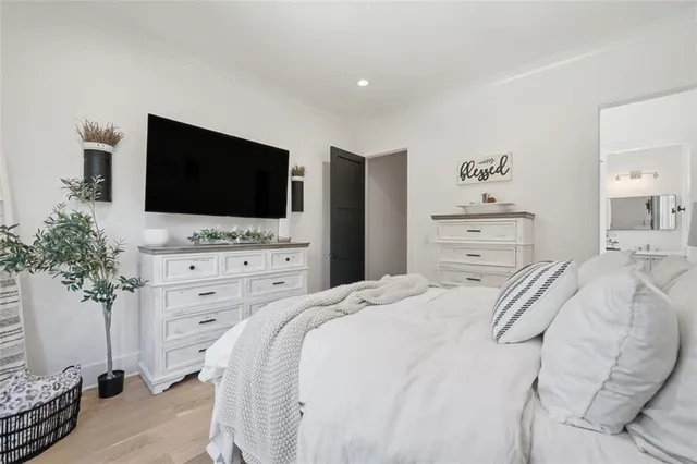 a room with a bed and a chandelier