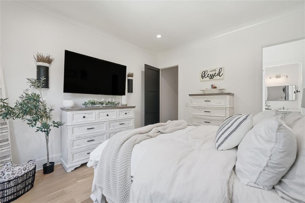 116 Owens Mill Place Canton, GA 30115 - Photo 19 of 65 a bedroom with a bed and a flat screen tv