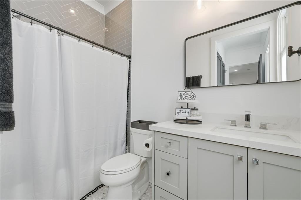 116 Owens Mill Place Canton, GA 30115 - Photo 20 of 65 a bathroom with a granite countertop sink toilet and mirror