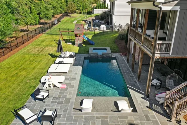 an aerial view of a house with a yard