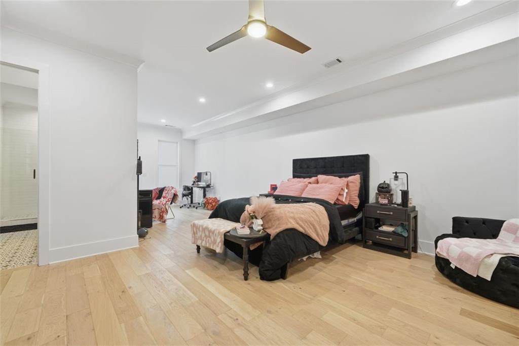 116 Owens Mill Place Canton, GA 30115 - Photo 25 of 65 a bedroom with a bed and wooden floor