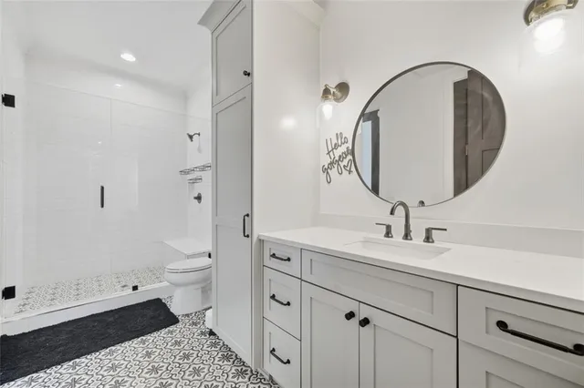 a view of an entryway with wooden floor and windows