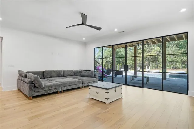 a view of a dining room with furniture wooden floor and chandelier