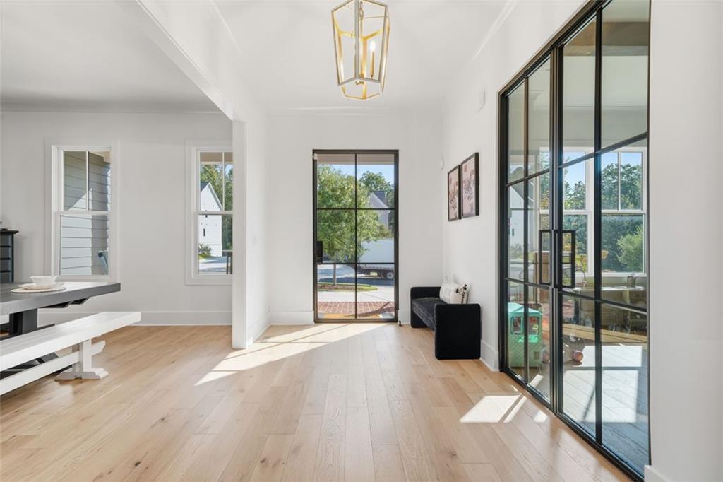 116 Owens Mill Place Canton, GA 30115 - Photo 32 of 65 a view of an entryway with wooden floor and windows