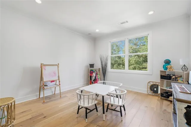 a view of workspace with furniture and a window