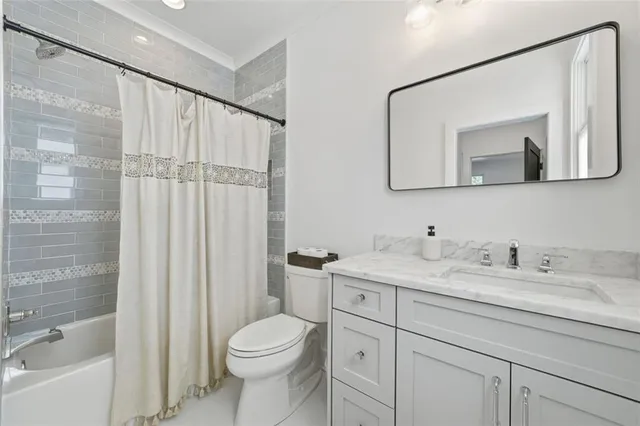 a bedroom with furniture and a large mirror