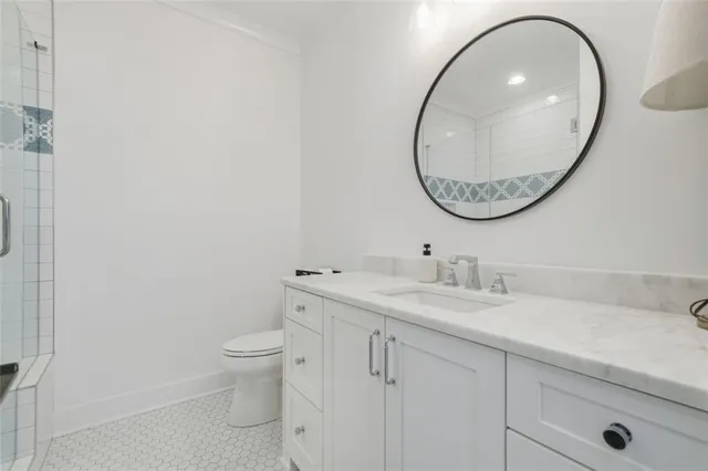 a kitchen with cabinets and window
