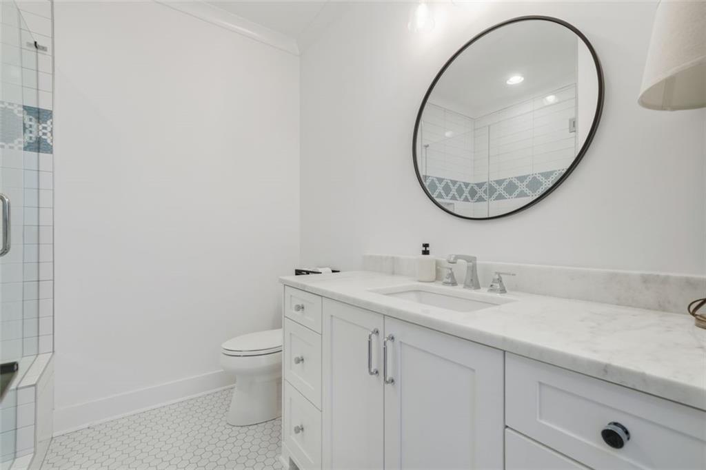 116 Owens Mill Place Canton, GA 30115 - Photo 43 of 65 a bathroom with a toilet a sink and a mirror