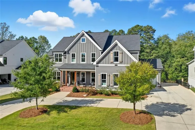 a bedroom with a bed window and a flat screen tv