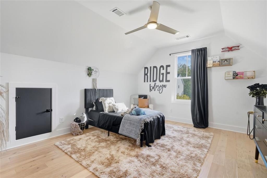 116 Owens Mill Place Canton, GA 30115 - Photo 46 of 65 a bedroom with furniture and a large mirror