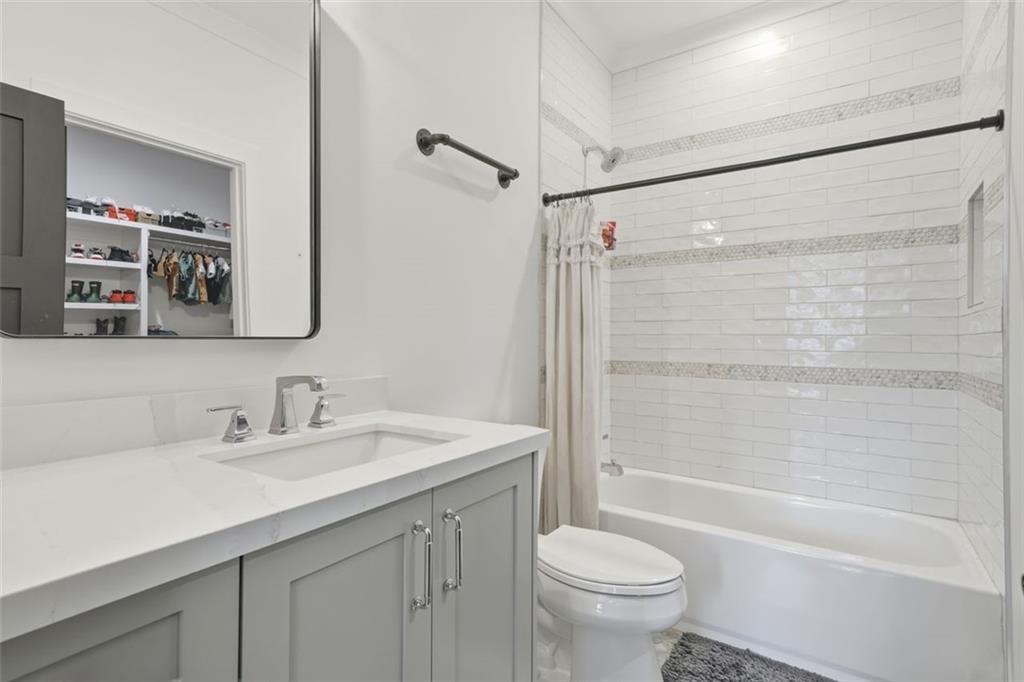 116 Owens Mill Place Canton, GA 30115 - Photo 48 of 65 a bathroom with a sink a toilet and a mirror