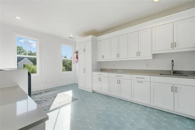 an aerial view of residential house with outdoor space and swimming pool