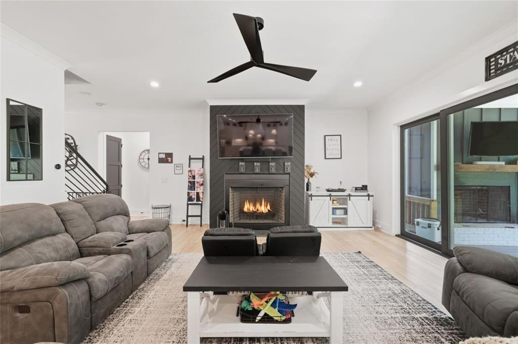 116 Owens Mill Place Canton, GA 30115 - Photo 9 of 65 a living room with furniture and a fireplace