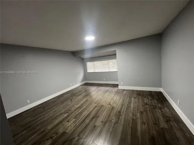 a bathroom with a double vanity sink and mirror