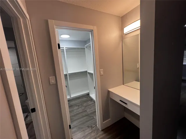 a bathroom with a sink and mirror