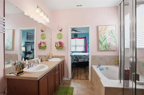 a bathroom with a sink toilet and a mirror