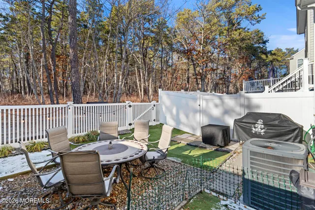 a view of a chairs and table in the patio