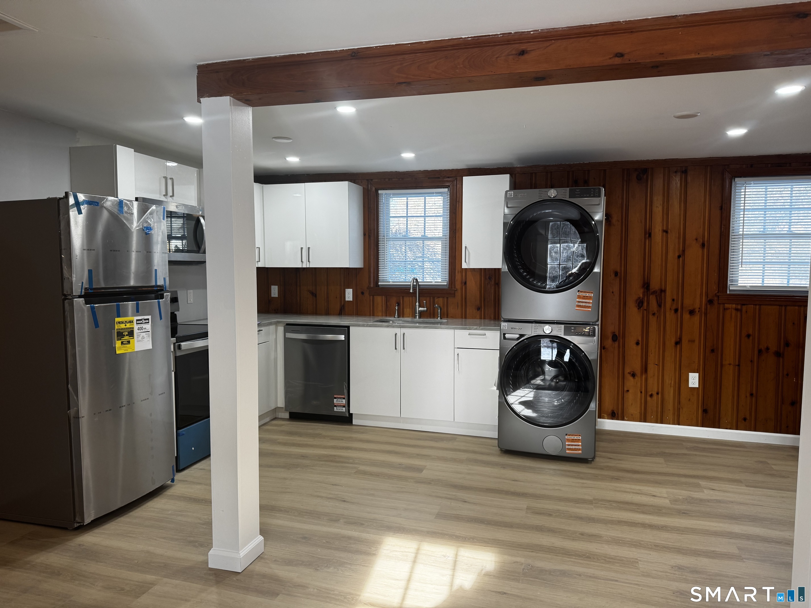 352 Hotchkiss Road Orange, CT 06477 - Photo 6 of 12 a kitchen with a refrigerator and a stove top oven