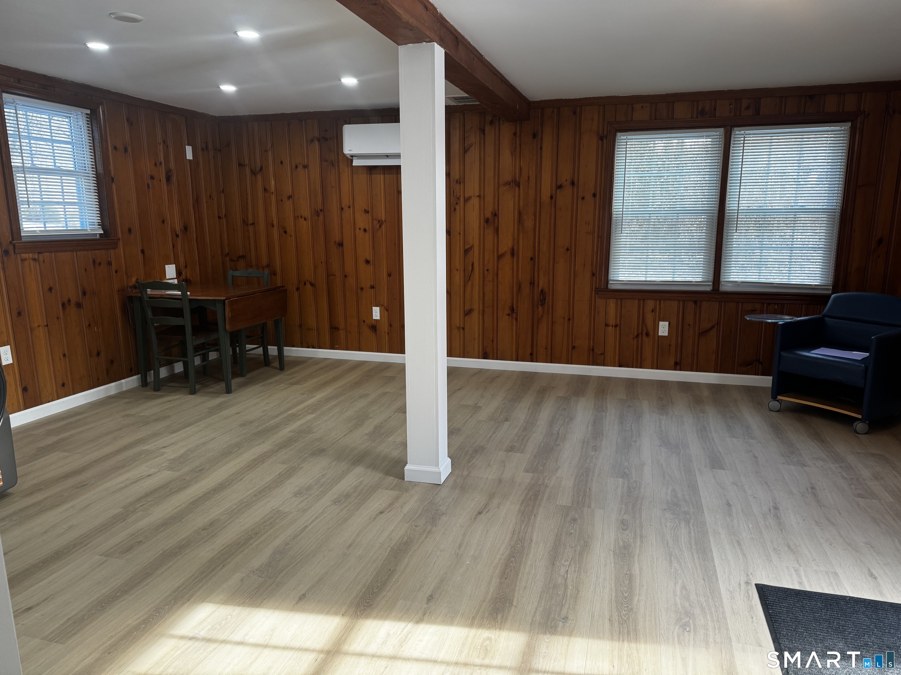 352 Hotchkiss Road Orange, CT 06477 - Photo 7 of 12 a view of a livingroom with furniture and wooden floor