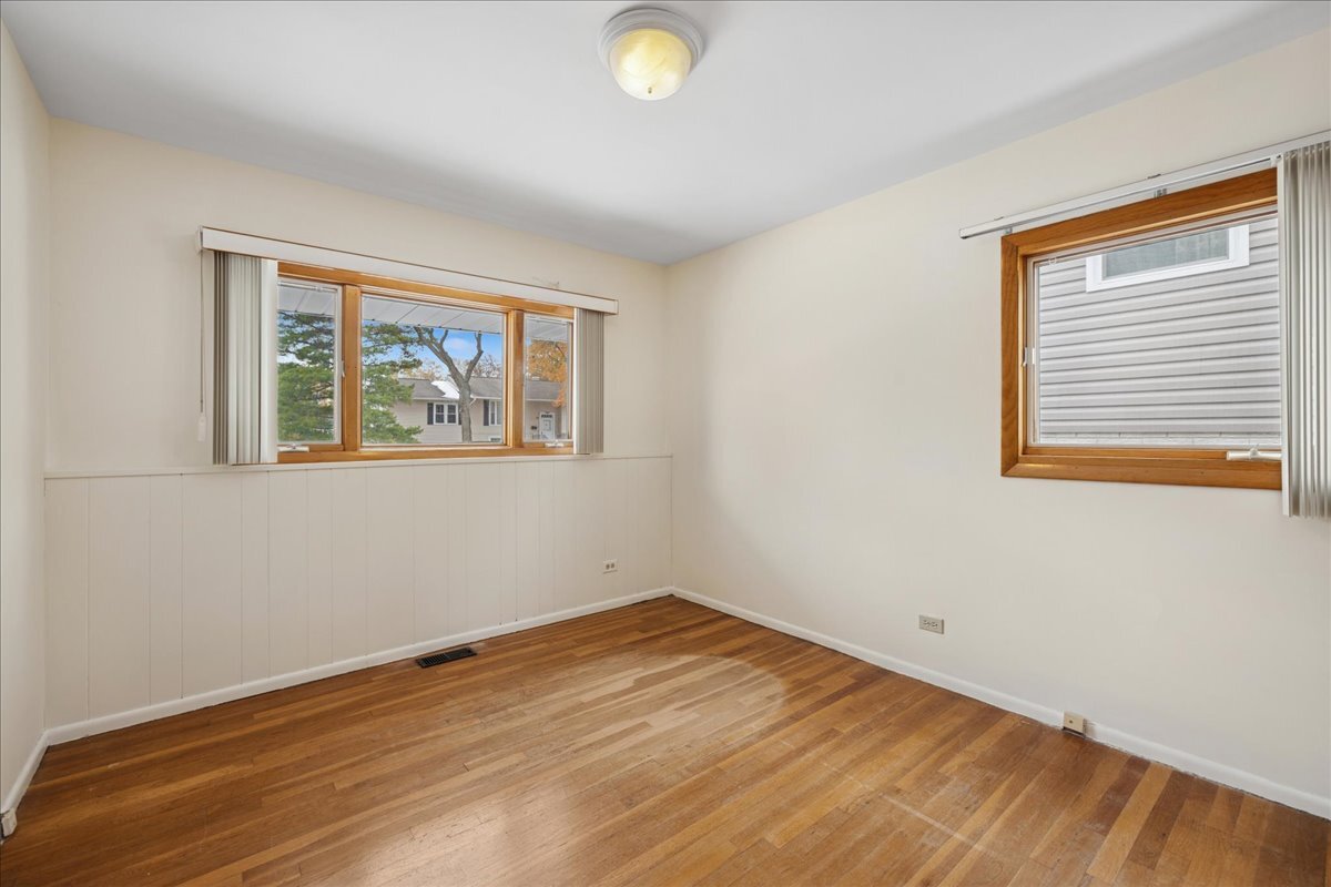 612 White Pine Road Buffalo Grove, IL 60089 - Photo 16 of 24 a view of empty room with wooden floor and fan